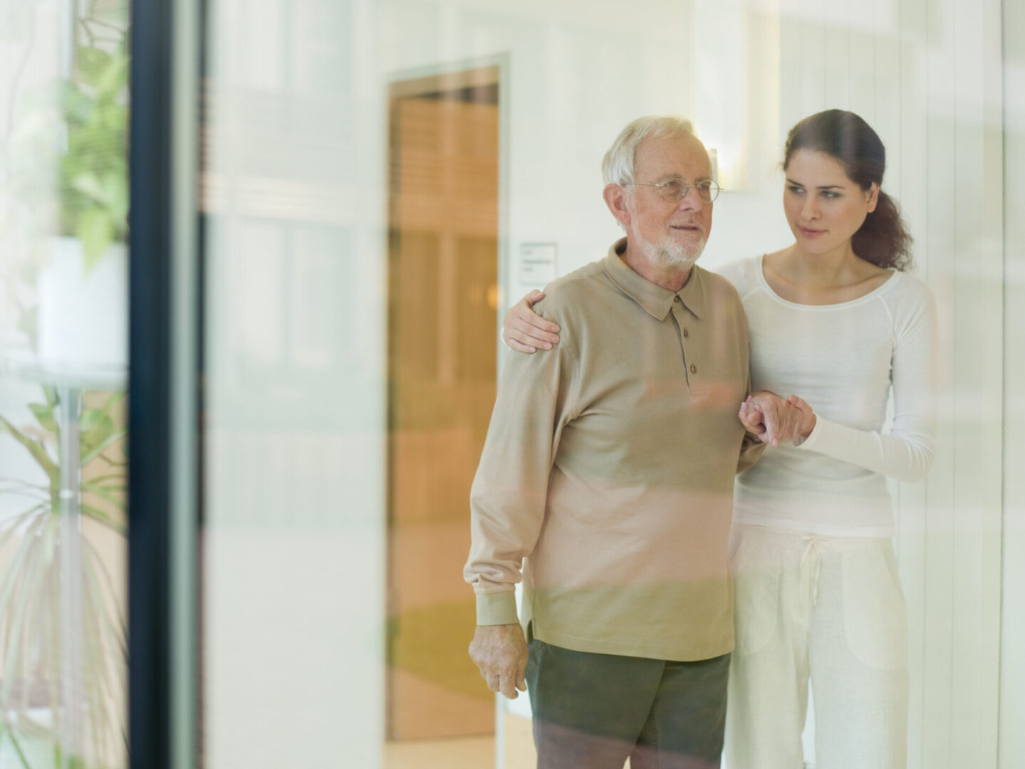 Senior man being helped by woman
